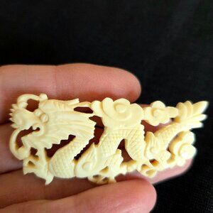 Vintage Asian carved dragon brooch.